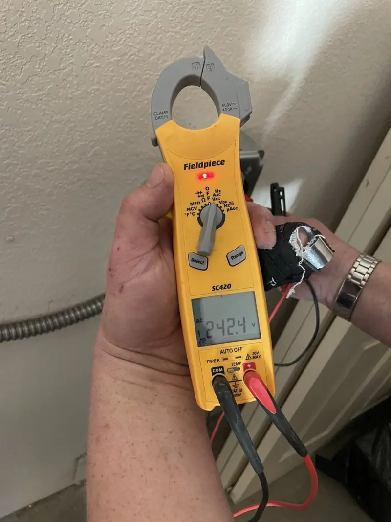 Voltage testing with clamp meter during Hot Tub / Pool Electrical Wiring in Cresco